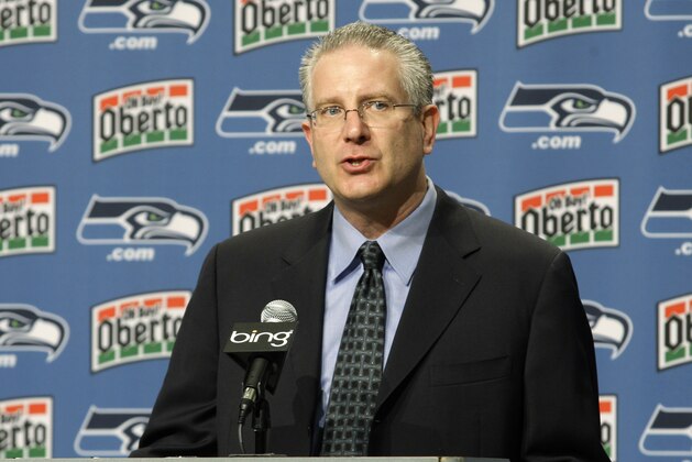 Seattle Seahawks CEO Tod Leiweke introduces Pete Carroll as the new coach and executive vice president of the Seattle Seahawks NFL football team, Tuesday, Jan. 12, 2010, at Seahawks headquarters in Renton, Wash. (AP Photo/Ted S. Warren)
