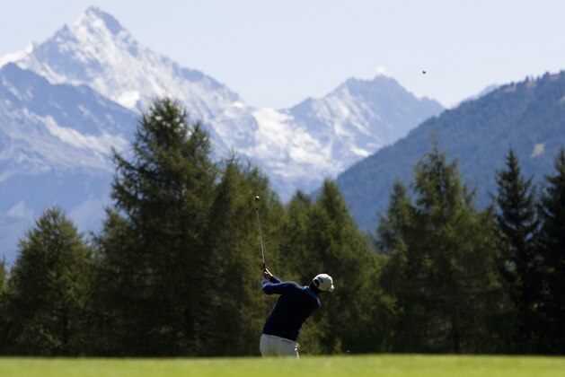 Sixteen years old Matteo Manassero from Italy plays the ball during the 3rd round of the Omega European Masters Golf Tournament in Crans Montana, Switzerland, Saturday, Sept. 5, 2009. (AP Photo/Keystone, Jean-Christophe Bott)