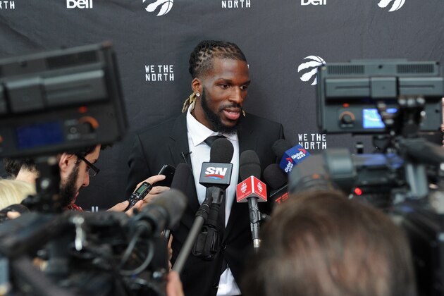 TORONTO, CANADA - JULY 9:  DeMarre Carroll #5 of the Toronto Raptors signs during a press conferences on July 9, 2015 at the Air Canada Centre in Toronto, Ontario, Canada.  NOTE TO USER: User expressly acknowledges and agrees that, by downloading and or using this Photograph, user is consenting to the terms and conditions of the Getty Images License Agreement.  Mandatory Copyright Notice: Copyright 2014 NBAE (Photo by Ron Turenne/NBAE via Getty Images)