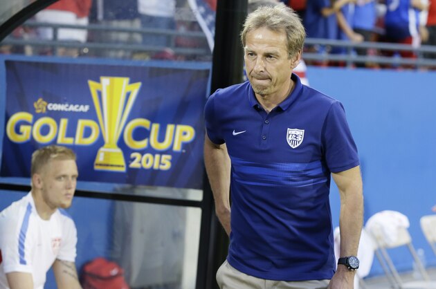 U.S. head soccer coach Jürgen Klinsmann walks onto the field before a CONCACAF Gold Cup opener soccer game against Honduras in Frisco, Texas, Tuesday, July 7, 2015. (AP Photo/LM Otero)