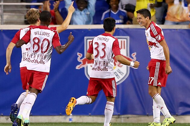 HARRISON, NJ - JULY 22:  Sean Davis #27 of New York Red Bulls celebrates his goal with teammates Jamie Thomas #33 and Devon Chesterton Williams #80 in the second half against Chelsea during the International Champions Cup at Red Bull Arena on July 22, 2015 in Harrison, New Jersey.The New York Red Bulls defeated Chelsea 4-2.  (Photo by Elsa/Getty Images)
