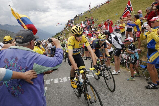 Britain's Chris Froome, wearing the overall leader's yellow jersey, Spain's Alejandro Valverde, right, Colombia's Nairo Quintana, wearing the best young rider's white jersey, rear left, and Spain's Alberto Contador, rear right, climb Croix de Fer pass during the nineteenth stage of the Tour de France cycling race over 138 kilometers (85.7 miles) with start in Saint-Jean-de-Maurienne and finish in La Toussuire, France, Friday, July 24, 2015. (AP Photo/Laurent Cipriani)