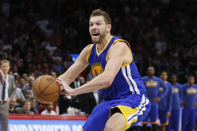 Golden State Warriors' David Lee passes the ball against the Los Angeles Clippers during the second half of an NBA basketball game, Tuesday, March 31, 2015, in Los Angeles. The Warriors won 110-106. (AP Photo/Danny Moloshok)
