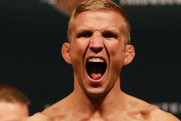 CHICAGO, IL - JULY 24:  UFC bantamweight champion TJ Dillashaw steps on the scale during the UFC weigh-in at the United Center on July 24, 2015 in Chicago, Illinois. (Photo by Rey Del Rio/Zuffa LLC/Zuffa LLC via Getty Images)