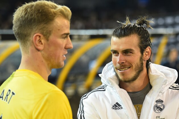 Gareth Bale, right, of Real Madrid speaks with Joe Hart of Manchester City following their International Championship Cup soccer match in Melbourne, Australia, Friday, July 24, 2015. (AP Photo/Theo Karanikos)