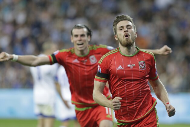 Aaron Ramsey, right and Gareth Bale celebrate after they scored against Israel  of Wales during the Euro 2016 qualifying group B soccer match in Haifa, Israel, Saturday, March 28, 2015. (AP Photo/Dusan Vranic)