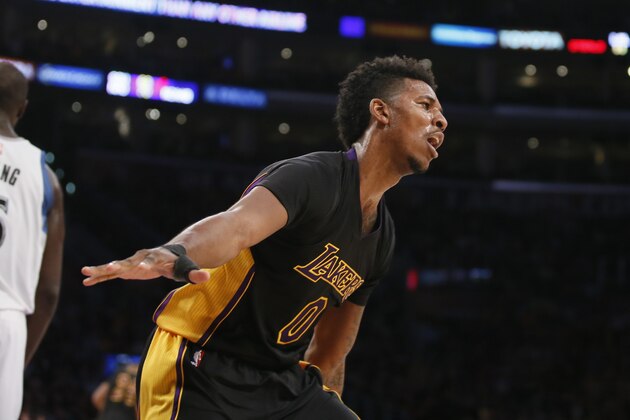 Los Angeles Lakers' Nick Young reacts after dunking the ball against the Minnesota Timberwolves during the second half of an NBA basketball game Friday, Nov. 28, 2014, in Los Angeles. The Timberwolves won 120-119. (AP Photo/Danny Moloshok)