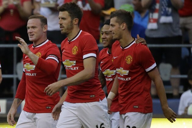 Manchester United players celebrate after Morgan Schneiderlin, far right, scored a goal against Club America during an international friendly soccer match, Friday, July 17, 2015, in Seattle. (AP Photo/Ted S. Warren) Manchester United players celebrate after Morgan Schneiderlin, far right, scored a goal against Club America during an international friendly soccer match, Friday, July 17, 2015, in Seattle. (AP Photo/Ted S. Warren)