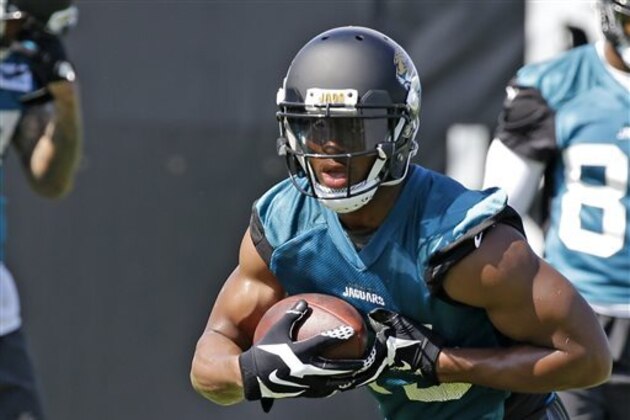 FILE - In this Wednesday, June 17, 2015, file photo, Jacksonville Jaguars wide receiver Allen Robinson runs with the ball after a reception during NFL football minicamp in Jacksonville, Fla. The Second-year receiver has been the star of Jacksonville's offseason program and the Jaguars are counting on it carrying over into the season.  (AP Photo/John Raoux, File)
