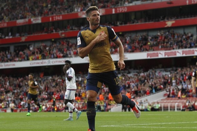 Arsenals French striker Olivier Giroud reacts to scoring the opening goal of the pre-season friendly football match between Arsenal and Lyon at The Emirates Stadium in north London on July 25, 2015, the game is one of four matches played over two days for the Emirates Cup. AFP PHOTO / IAN KINGTON

RESTRICTED TO EDITORIAL USE. No use with unauthorised audio, video, data, fixture lists, club/league logos or live services. Online in-match use limited to 45 images, no video emulation. No use in betting, games or single club/league/player publications.        (Photo credit should read IAN KINGTON/AFP/Getty Images)