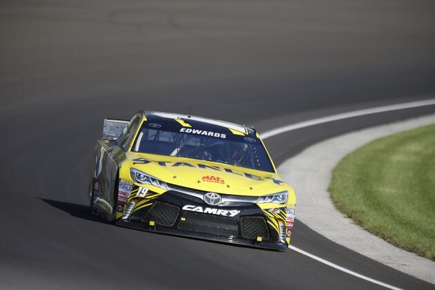 Sprint Cup Series driver Carl Edwards (19) drives through the first turn during practice for the NASCAR Brickyard 400 auto race at Indianapolis Motor Speedway in Indianapolis, Friday, July 24, 2015. (AP Photo/Michael Conroy)