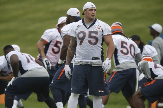 Denver Broncos defensive end Derek Wolfe takes part in drills during an NFL minicamp at the team's headquarters Wednesday, June 10, 2015, in Englewood, Colo. (AP Photo/David Zalubowski)