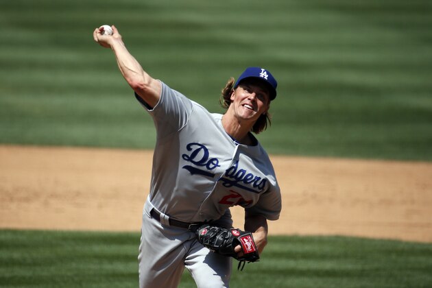 Los Angeles Dodgers starting pitcher Zack Greinke (21) throws during a baseball game against the Washington Nationals at Nationals Park, Sunday, July 19, 2015, in Washington. (AP Photo/Alex Brandon)