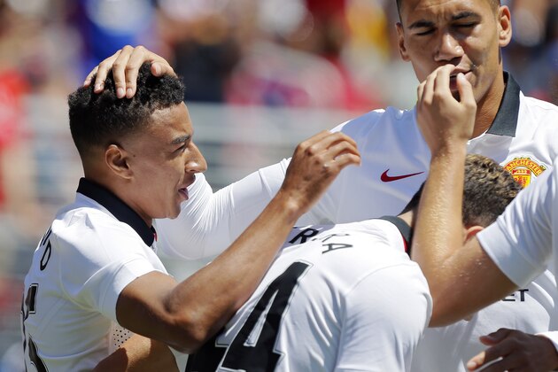 SANTA CLARA, CA - JULY 25:  Jesse Lingard #35 of Manchester United celebrates with his mates after scoring against FC Barcelona in the 65th minute during the International Champions Cup on July 25, 2015 at Levi's Stadium in Santa Clara, California.  Machester United won 3-1.  (Photo by Brian Bahr/Getty Images)