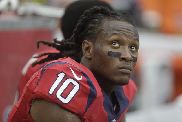 Houston Texans wide receiver DeAndre Hopkins (10) sits on the bench during the third quarter of an NFL football game, Sunday, Nov. 2, 2014, in Houston. (AP Photo/Patric Schneider)