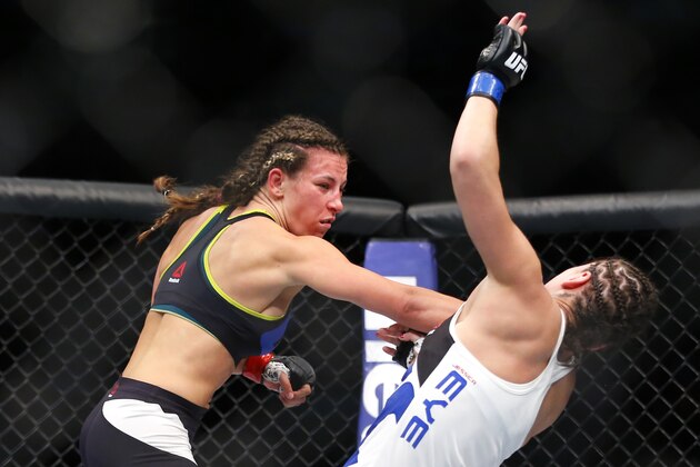 Miesha Tate, left, knocks down Jessica Eye during their women's bantamweight mixed martial arts bout during UFC Chicago on Saturday, July 25, 2015, in Chicago. (AP Photo/Jeff Haynes) Miesha Tate, left, knocks down Jessica Eye during their women's bantamweight mixed martial arts bout during UFC Chicago on Saturday, July 25, 2015, in Chicago. (AP Photo/Jeff Haynes)