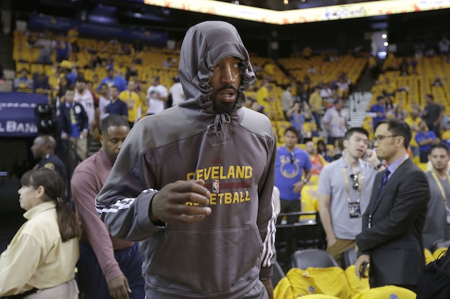 Cleveland Cavaliers guard J.R. Smith walks on to the court before Game 1 of basketball's NBA Finals against the Golden State Warriors in Oakland, Calif., Thursday, June 4, 2015. (AP Photo/Ben Margot)