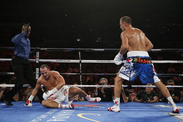 Sergey Kovalev knocks down Nadjib Mohammedi to win their light heavyweight title boxing bout Saturday, July 25, 2015, in Las Vegas. (AP Photo/John Locher)