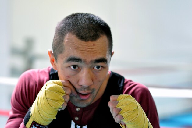 In this photo taken April 5, 2014, WBA and IBA light heavyweight boxing champion Beibut Shumenov, of Kazakhstan,  poses in Las Vegas. Shumenov and IBF light heavyweight champion Bernard Hopkins will fight at the DC Armory on Saturday, April 19. (AP Photo/Joe Coomber)