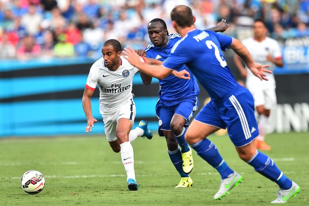 Paris Saint-Germain's Lucas Moura (L) vies with Chelsea's Victor Moses (C) and Branislav Ivanovic during an International Champions Cup football match in Charlotte, North Carolina, on July 25, 2015. AFP PHOTO/NICHOLAS KAMM (Photo credit should read NICHOLAS KAMM/AFP/Getty Images) Paris Saint-Germain's Lucas Moura (L) vies with Chelsea's Victor Moses (C) and Branislav Ivanovic during an International Champions Cup football match in Charlotte, North Carolina, on July 25, 2015. AFP PHOTO/NICHOLAS KAMM (Photo credit should read NICHOLAS KAMM/AFP/Getty Images)