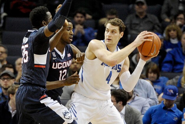 Feb 19, 2015; Memphis, TN, USA; Connecticut Huskies forward Kentan Facey (12) guards Memphis Tigers forward Austin Nichols (4) during the game at FedExForum. Mandatory Credit: Justin Ford-USA TODAY Sports