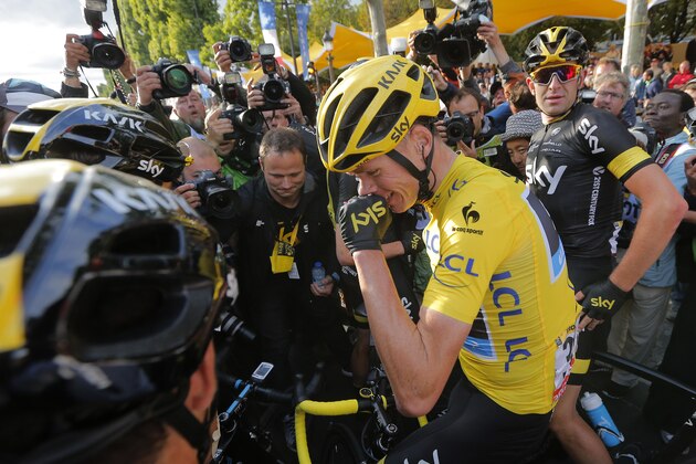 2015 Tour de France cycling race winner Britain's Chris Froome celebrates after the twenty-first and last stage of the Tour de France cycling race over 109.5 kilometers (68 miles) with start in Sevres and finish in Paris, France, Sunday, July 26, 2015. (AP Photo/Christophe Ena)