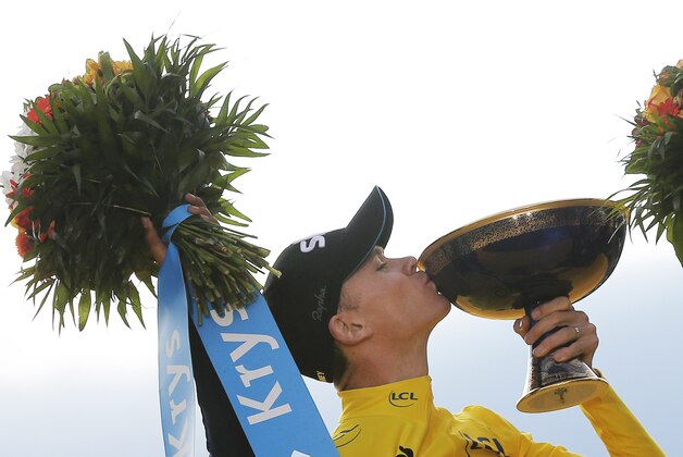 2015 Tour de France cycling race winner Chris Froome of Britain celebrates on the podium after the twenty-first and last stage of the Tour de France cycling race over 109.5 kilometers (68 miles) with start in Sevres and finish in Paris, France, Sunday, July 26, 2015. (AP Photo/Christophe Ena)