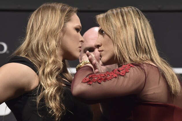 RIO DE JANEIRO, BRAZIL - MARCH 20: (EDITORS NOTE: Retransmission with alternate crop.)  UFC Women's Bantamweight Champion Ronda Rousey of the United States and Bethe Correia of Brazil face off as UFC President Dana White (C) stands in during the 189 World Media Tour Launch press conference at Maracanazinho on March 20, 2015 in Rio de Janeiro, Brazil.  (Photo by Buda Mendes/Zuffa LLC/Zuffa LLC via Getty Images)