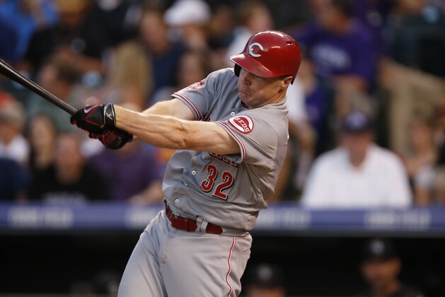 Cincinnati Reds right fielder Jay Bruce (32) bats against the Colorado Rockies in the seventh inning of a baseball game Saturday, July 25, 2015, in Denver. Cincinnati won 5-2. (AP Photo/David Zalubowski)