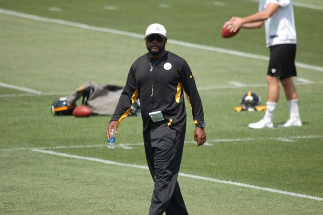 Mike Tomlin watches over his team at the opening practice of training camp.
