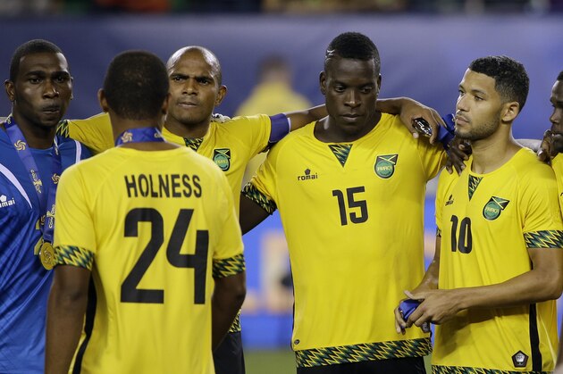 Jamaica players react after losing 3-1 in the CONCACAF Gold Cup championship soccer match against Mexico, Sunday, July 26, 2015, in Philadelphia. (AP Photo/Matt Rourke)