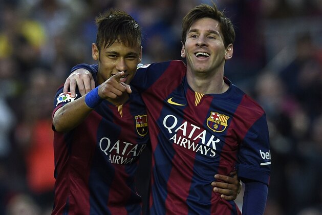 Barcelona's Brazilian forward Neymar da Silva Santos Junior (L) and Barcelona's Argentinian forward Lionel Messi (R) celebrate after scoring a goal during the Spanish league football match FC Barcelona vs Getafe at the Camp Nou stadium in Barcelona on April 28, 2015.   AFP PHOTO/ LLUIS GENE        (Photo credit should read LLUIS GENE/AFP/Getty Images)