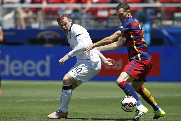 IMAGE DISTRIBUTED FOR INTERNATIONAL CHAMPIONS CUP - Manchester United's Wayne Rooney, left, and FC Barcelona's Thomas Vermaelen struggle for the ball during an International Champions Cup soccer match at Levi's Stadium, Saturday, June 25, 2015, in Santa Clara, Calif. (Terrell Lloyd/AP Images for International Champions Cup) IMAGE DISTRIBUTED FOR INTERNATIONAL CHAMPIONS CUP - Manchester United's Wayne Rooney, left, and FC Barcelona's Thomas Vermaelen struggle for the ball during an International Champions Cup soccer match at Levi's Stadium, Saturday, June 25, 2015, in Santa Clara, Calif. (Terrell Lloyd/AP Images for International Champions Cup)