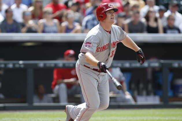 Cincinnati Reds' Jay Bruce follows the flight of his three-run home run off Colorado Rockies starting pitcher Kyle Kendrick in the third inning of a baseball game Sunday, July 26, 2015, in Denver. (AP Photo/David Zalubowski)