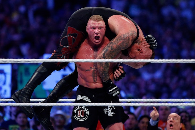The Undertake, top, and Brock Lesnar, bottom, compete during Wrestlemania XXX at the Mercedes-Benz Super Dome in New Orleans on Sunday, April 6, 2014. (Jonathan Bachman/AP Images for WWE) The Undertake, top, and Brock Lesnar, bottom, compete during Wrestlemania XXX at the Mercedes-Benz Super Dome in New Orleans on Sunday, April 6, 2014. (Jonathan Bachman/AP Images for WWE)