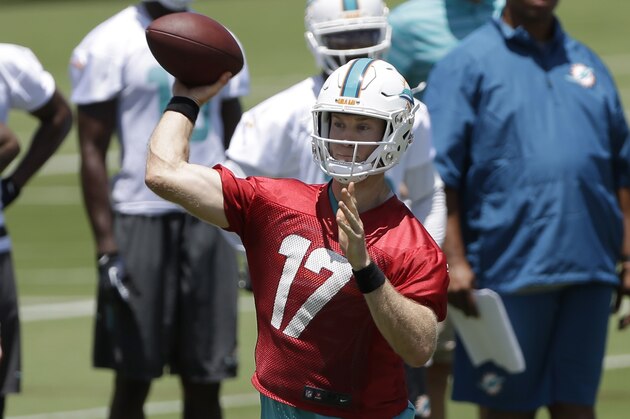 Miami Dolphins quarterback Ryan Tannehill (17) passes during NFL football minicamp,   Tuesday, June 16, 2015, in Davie, Fla. (AP Photo/Alan Diaz)
