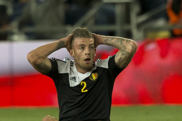 Belgium's defender Toby Alderweireld , back, holds his head after a tackle on Israel's forward Tomer Hemed during Euro 2016 group B qualifying soccer match in Jerusalem, Tuesday, March 31, 2015. (AP Photo/Ariel Schalit)