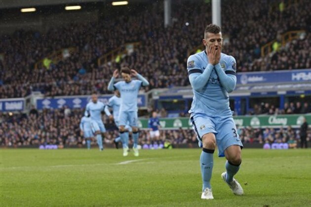 Manchester City's Stevan Jovetic, right, reacts after a missed opportunity during his team's English Premier League soccer match between Everton and Manchester City at Goodison Park Stadium, Liverpool, England, Saturday Jan. 10, 2015. (AP Photo/Jon Super)