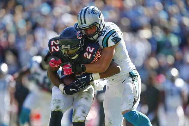 Carolina Panthers middle linebacker Luke Kuechly (59) tackles Chicago Bears running back Matt Forte (22) during an NFL game at Bank of America Stadium in Charlotte, N.C. on Sunday, Oct. 5, 2014. (Chris Keane/AP Images for Panini)