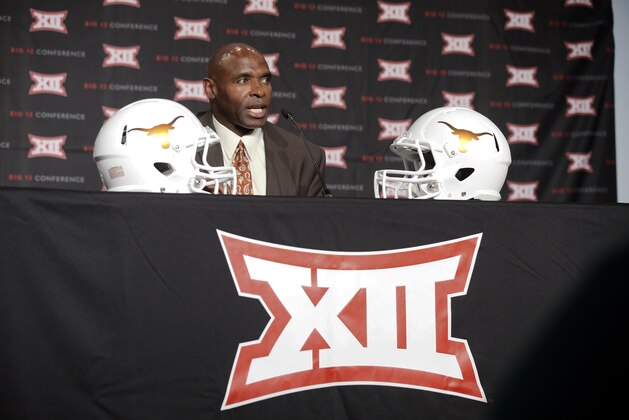 Texas head football coach Charlie Strong responds to questions during the Big 12 Conference Football Media Days Tuesday, July 21, 2015, in Dallas. (AP Photo/Tony Gutierrez)