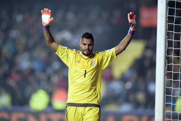 Argentina's goalkeeper Sergio Romero celebrates a goal against Paraguay during their Copa America semifinal football match in Concepcion, Chile on June 30, 2015.   AFP PHOTO / JUAN MABROMATA        (Photo credit should read JUAN MABROMATA/AFP/Getty Images)