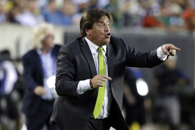 Mexico head coach Miguel Herrera yells during the first half of the CONCACAF Gold Cup championship soccer match against Jamaica, Sunday, July 26, 2015, in Philadelphia. (AP Photo/Matt Rourke)