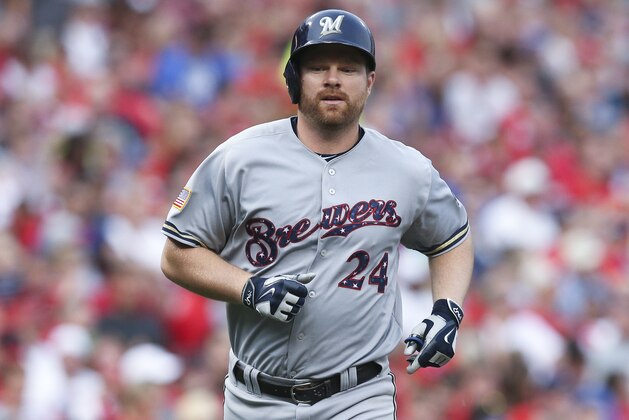 Milwaukee Brewers' Adam Lind runs home after hitting a solo home run off Cincinnati Reds starting pitcher Josh Smith in the fourth inning of a baseball game, Saturday, July 4, 2015, in Cincinnati. The Brewers won 7-3. (AP Photo/John Minchillo)