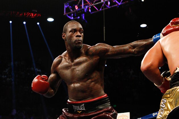 Jun 13, 2015; Birmingham, AL, USA;  Deontay Wilder hits Eric Molina during the WBC Championship at Bartow Arena. Mandatory Credit: Marvin Gentry-USA TODAY Sports