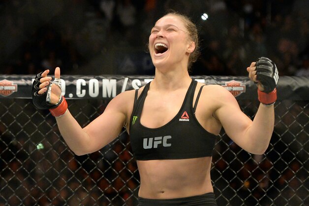 Feb 28, 2015; Los Angeles, CA, USA; Ronda Rousey (red gloves) reacts after defeating Cat Zingano (not pictured) during their women's bantamweight title bout at UFC 184 at Staples Center. Rousey won in 14 seconds of the first round. Mandatory Credit: Jayne Kamin-Oncea-USA TODAY Sports