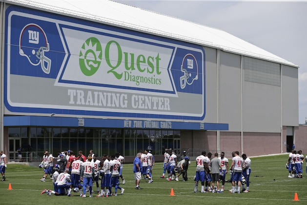 New York Giants players gather after practice at NFL football minicamp, Wednesday, June 17, 2015, in East Rutherford, N.J.  (AP Photo/Frank Franklin II)