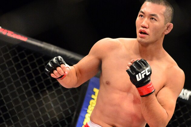 Sep 4, 2013; Belo Horizonte, BRAZIL;  Yushin Okami (red shorts) during his fight against Ronaldo Jacare Souza (not pictured) during UFC Fight Night at Mineirinho Arena. Mandatory Credit: Jason Silva-USA TODAY Sports