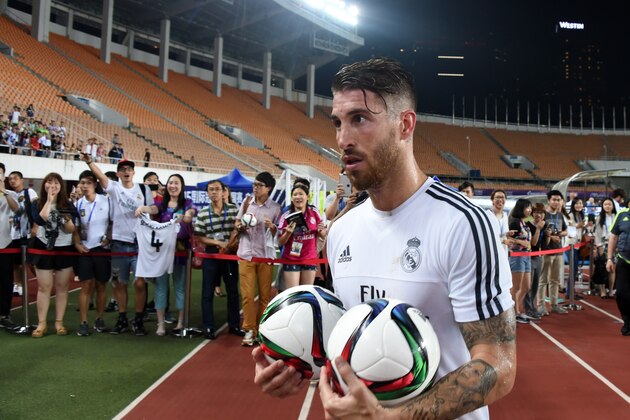 Real Madrid's defender Sergio Ramos holds two ball after  a training session on the eve of the International Champions Cup football match between Inter Milan and Real Madrid in Guagnzhou on July 26, 2015. AFP PHOTO / JOHANNES EISELE        (Photo credit should read JOHANNES EISELE/AFP/Getty Images)