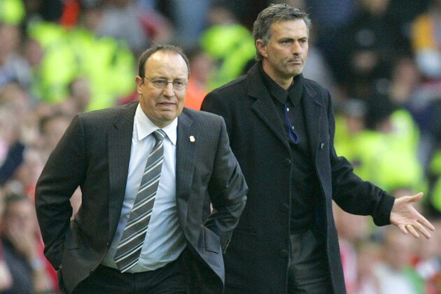 Liverpool's coach Rafael Benitez , left, looks  at play as Chelsea coach Jose Mourinho gestures to his team during  their Champions League semifinal second leg soccer match at Liverpool's Anfield stadium in Liverpool England, Tuesday May 1, 2007. (AP Photo/ Tom Hevezi)