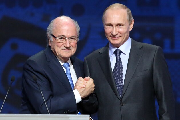 Outgoing FIFA president Sepp Blatter shakes hands with Russian President Vladimir Putin (R) ahead of the preliminary draw for the 2018 World Cup qualifiers at the Konstantin Palace in Saint Petersburg on July 25, 2015.  AFP PHOTO / KIRILL KUDRYAVTSEV        (Photo credit should read KIRILL KUDRYAVTSEV/AFP/Getty Images)